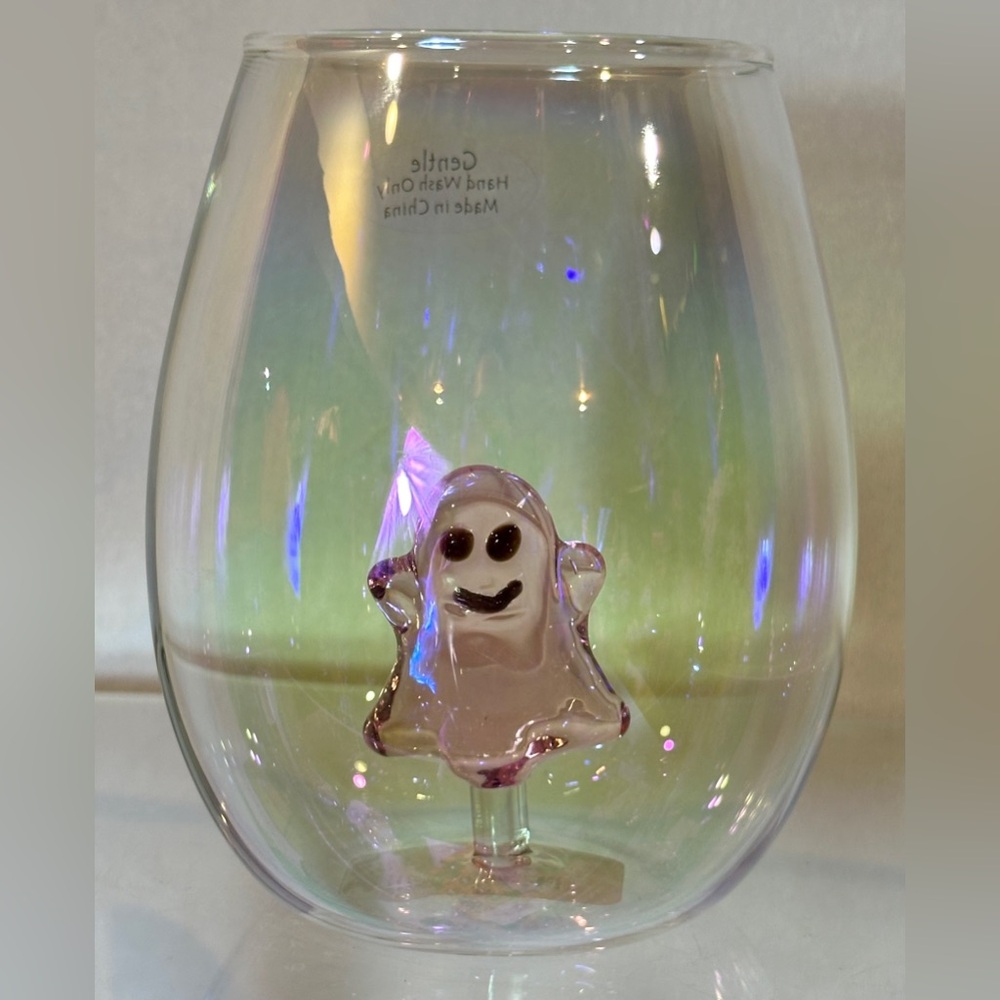 Pretty iridescent glassware with pink glass ghost in bottom of glass